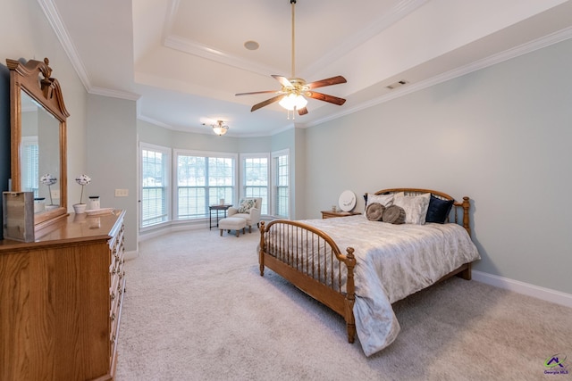 bedroom featuring light carpet, ceiling fan, crown molding, and a raised ceiling