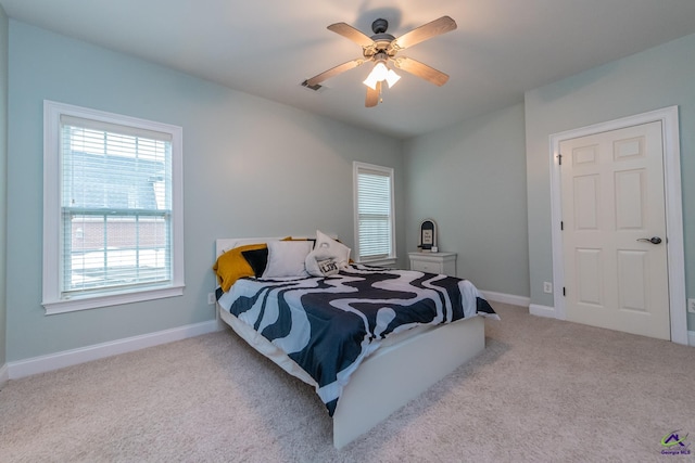 carpeted bedroom with ceiling fan