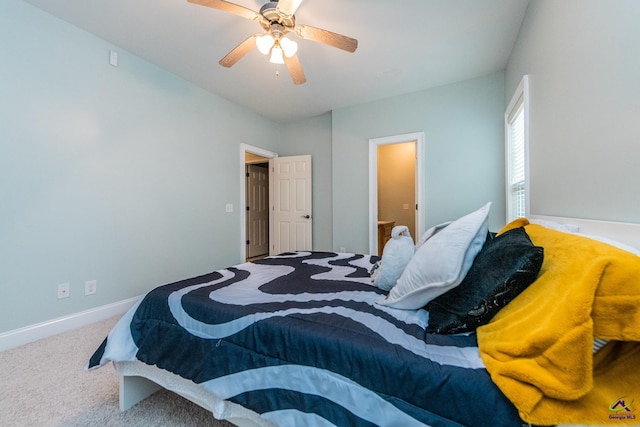 bedroom featuring ceiling fan and carpet