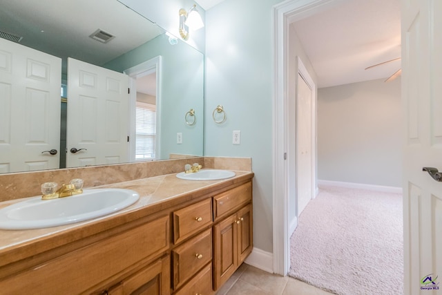 bathroom featuring ceiling fan, tile patterned flooring, and vanity