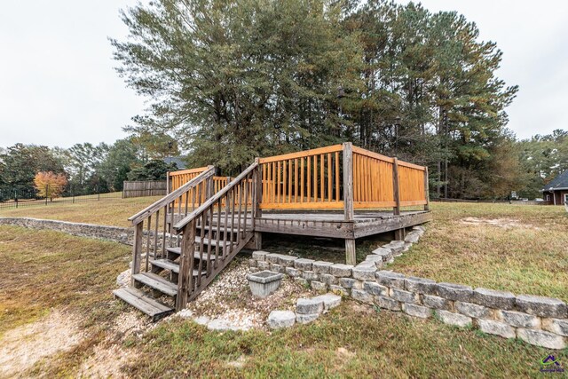 wooden terrace with a lawn