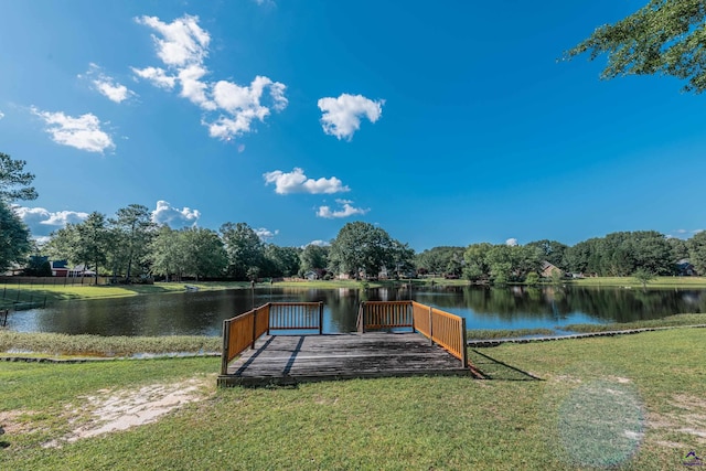 dock area featuring a yard and a water view