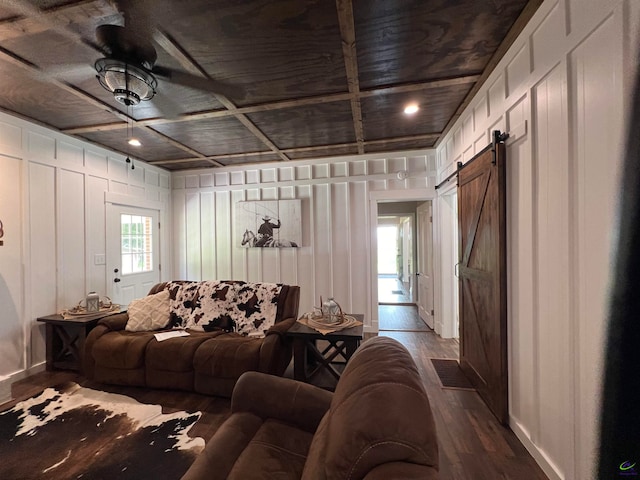 living room featuring hardwood / wood-style floors, wood ceiling, a barn door, and coffered ceiling