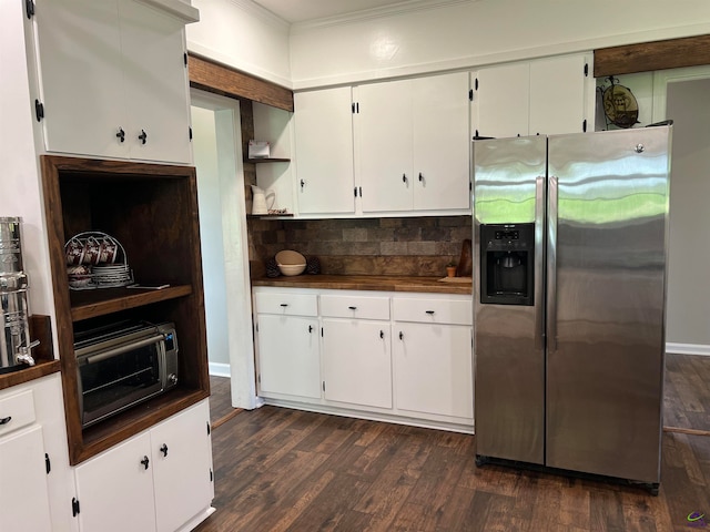 kitchen with white cabinets, dark wood-type flooring, stainless steel fridge, and tasteful backsplash