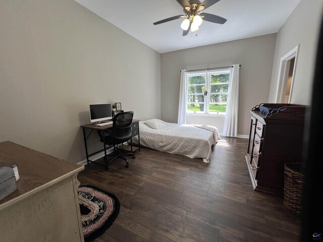 bedroom featuring dark hardwood / wood-style flooring and ceiling fan