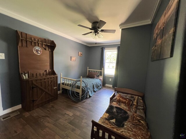 bedroom with ornamental molding, ceiling fan, and dark hardwood / wood-style floors