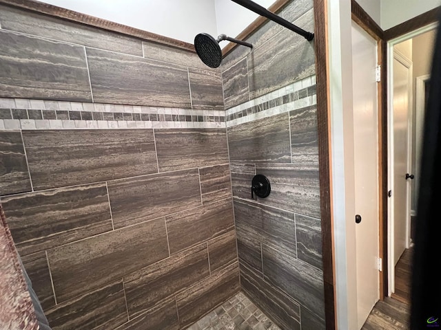 bathroom with a tile shower