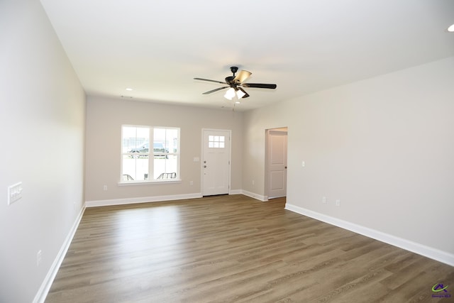 empty room featuring ceiling fan and wood-type flooring