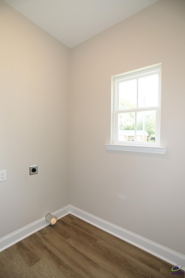 laundry area featuring dark hardwood / wood-style flooring and hookup for an electric dryer