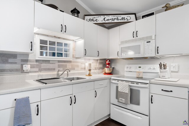 kitchen featuring sink, white cabinetry, tasteful backsplash, and white appliances