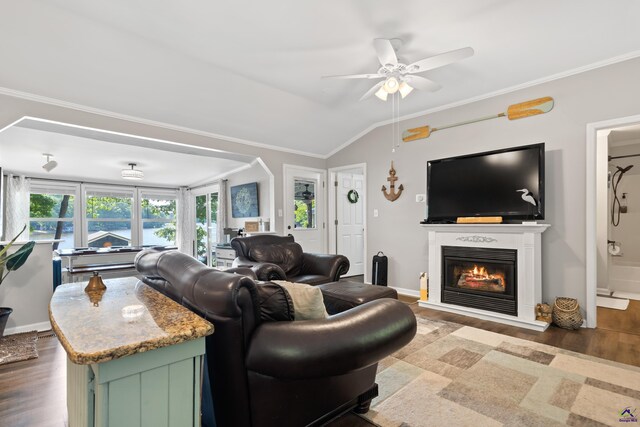 living room with hardwood / wood-style flooring and ornamental molding