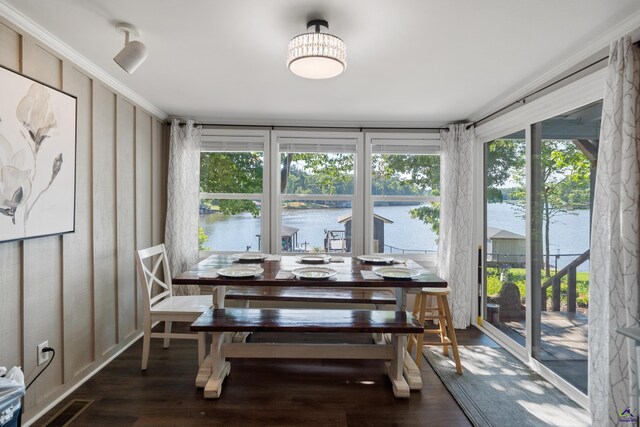 sunroom / solarium with a water view