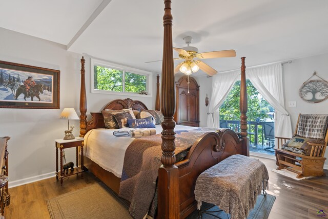 bedroom with multiple windows, ceiling fan, and hardwood / wood-style floors