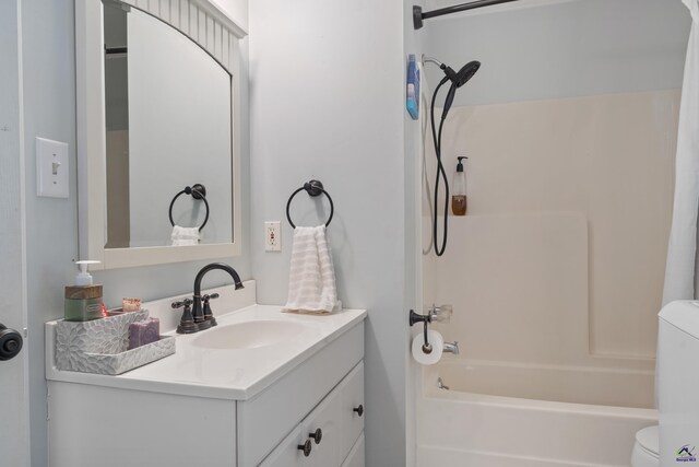 full bathroom featuring vanity, shower / bath combination, and toilet