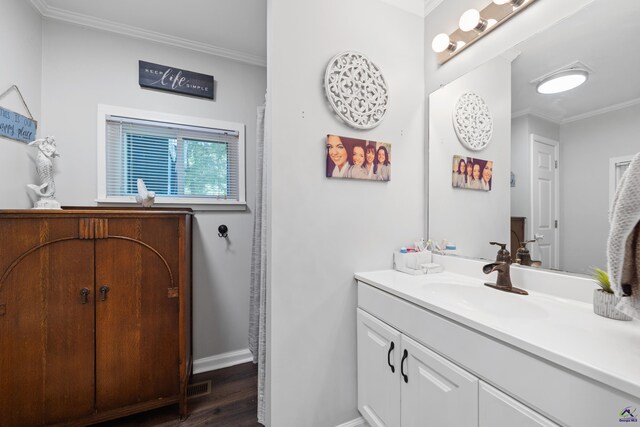 bathroom with vanity, wood-type flooring, and ornamental molding