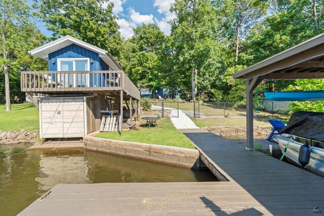 view of dock featuring a yard