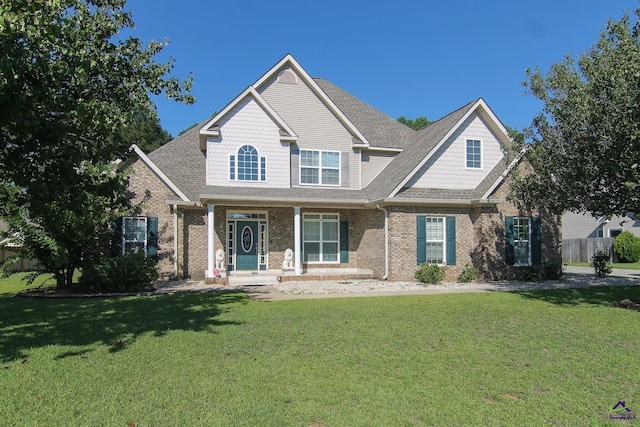 view of front of house featuring a front yard and a porch