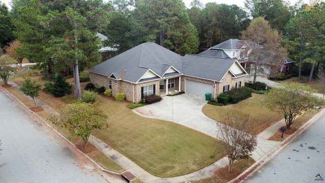 ranch-style home featuring a front yard