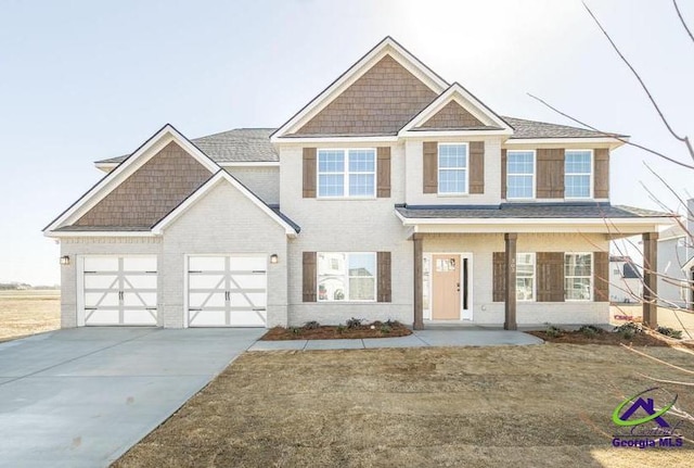 view of front of house with concrete driveway and brick siding