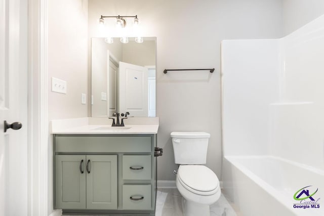 full bathroom featuring marble finish floor, toilet, vanity, and baseboards