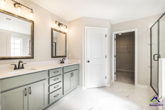 bathroom featuring a shower stall, visible vents, and a sink