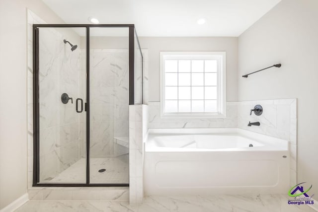 full bath featuring marble finish floor, a bath, and a shower stall