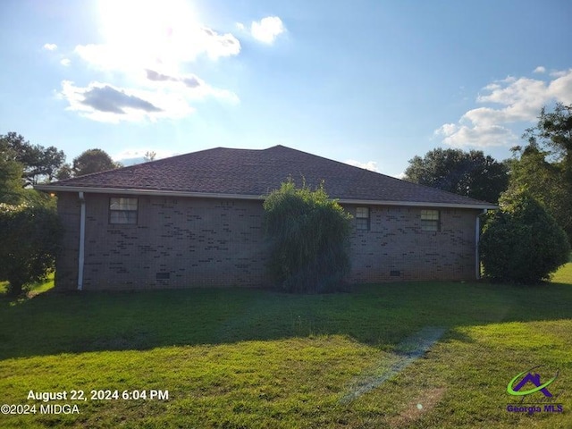 view of property exterior featuring a lawn