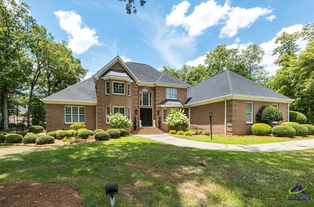 view of front of home with a front lawn