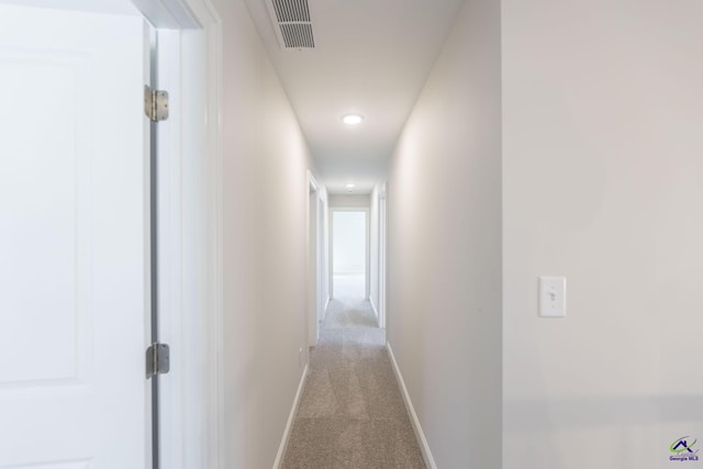 corridor with light carpet