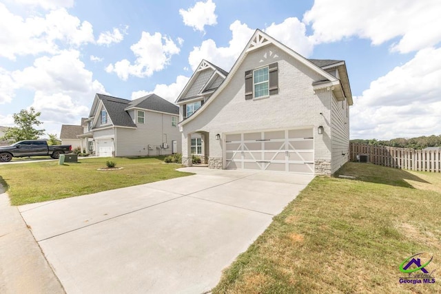 view of front of home featuring a garage and a front lawn