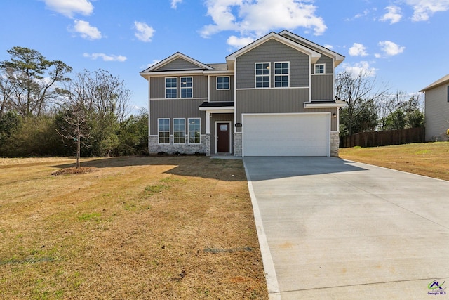 view of front of home featuring an attached garage, stone siding, driveway, and a front lawn