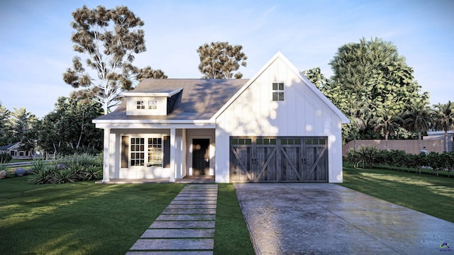 view of front of property featuring a front lawn and a garage