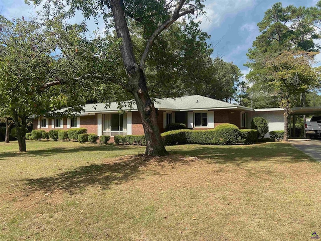 ranch-style house with a front lawn and a carport