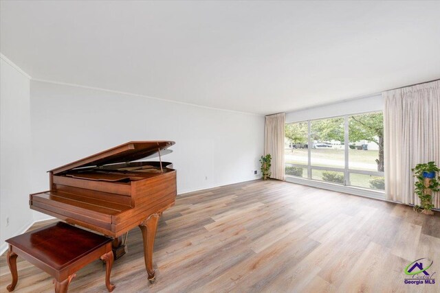 unfurnished sunroom with an inviting chandelier and beamed ceiling