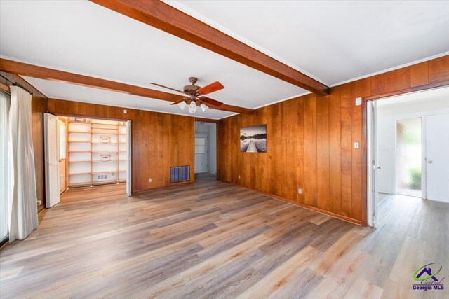 entryway with light hardwood / wood-style flooring, a notable chandelier, and ornamental molding