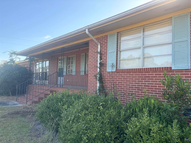 view of side of property featuring a porch