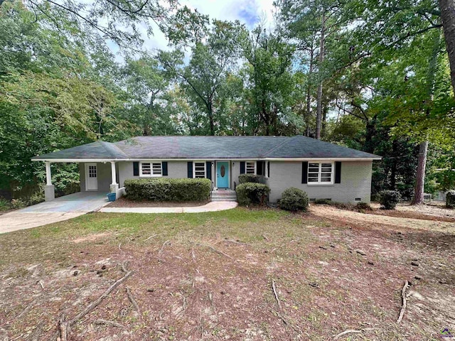 ranch-style home with a carport