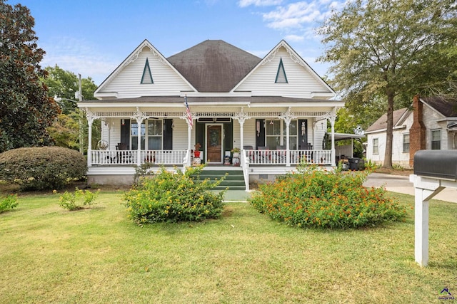 view of front of house featuring a front lawn and a porch