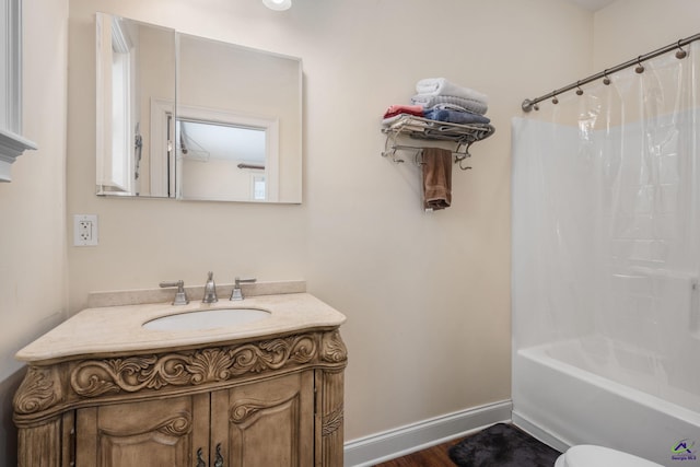 full bathroom featuring vanity, toilet, wood-type flooring, and shower / tub combo with curtain