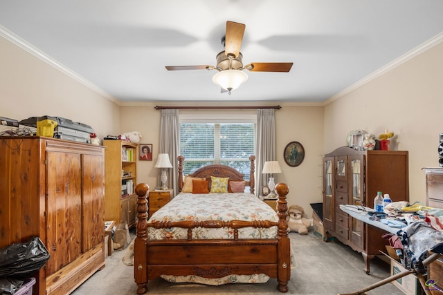 carpeted bedroom with crown molding and ceiling fan