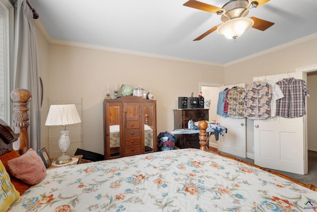 carpeted bedroom with ceiling fan and ornamental molding