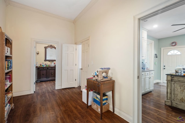 corridor featuring dark hardwood / wood-style flooring and crown molding