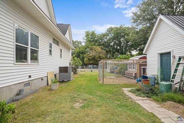 view of yard with central AC unit