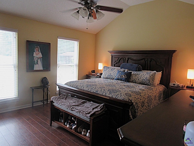 bedroom featuring lofted ceiling, ceiling fan, and dark wood-type flooring