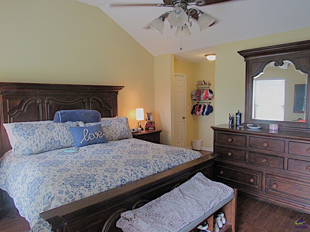 bedroom featuring lofted ceiling, ceiling fan, and dark hardwood / wood-style floors