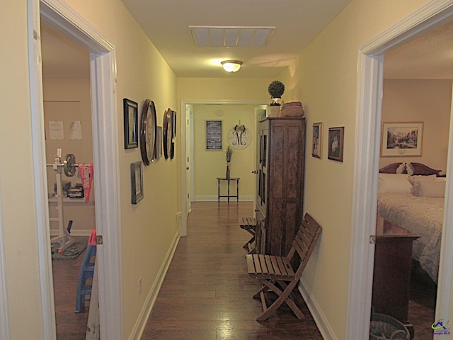 hall with dark hardwood / wood-style floors