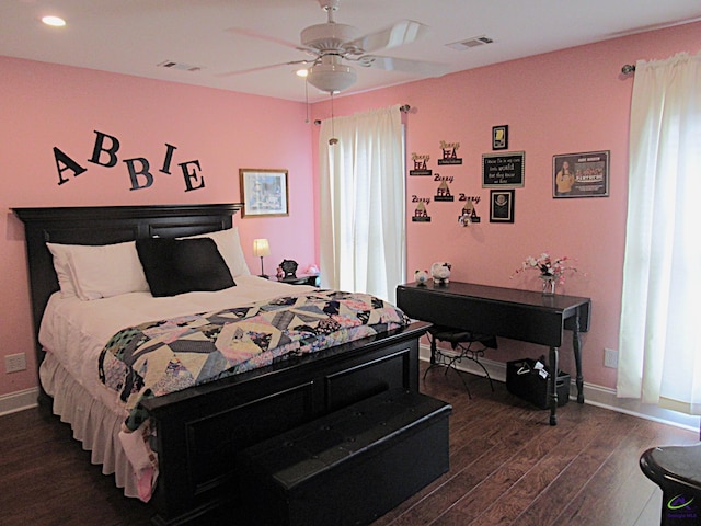 bedroom with ceiling fan and dark hardwood / wood-style floors