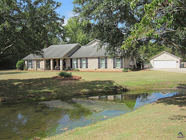 ranch-style home with a water view and a front yard