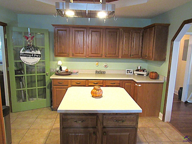 kitchen with a center island and light tile patterned floors