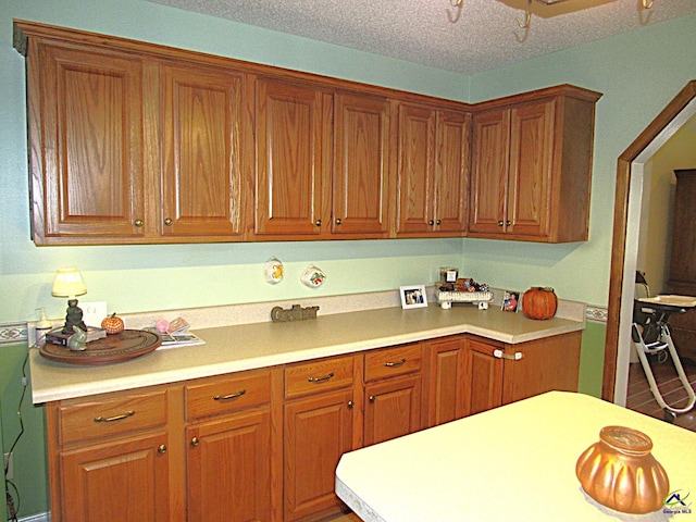 kitchen with a textured ceiling